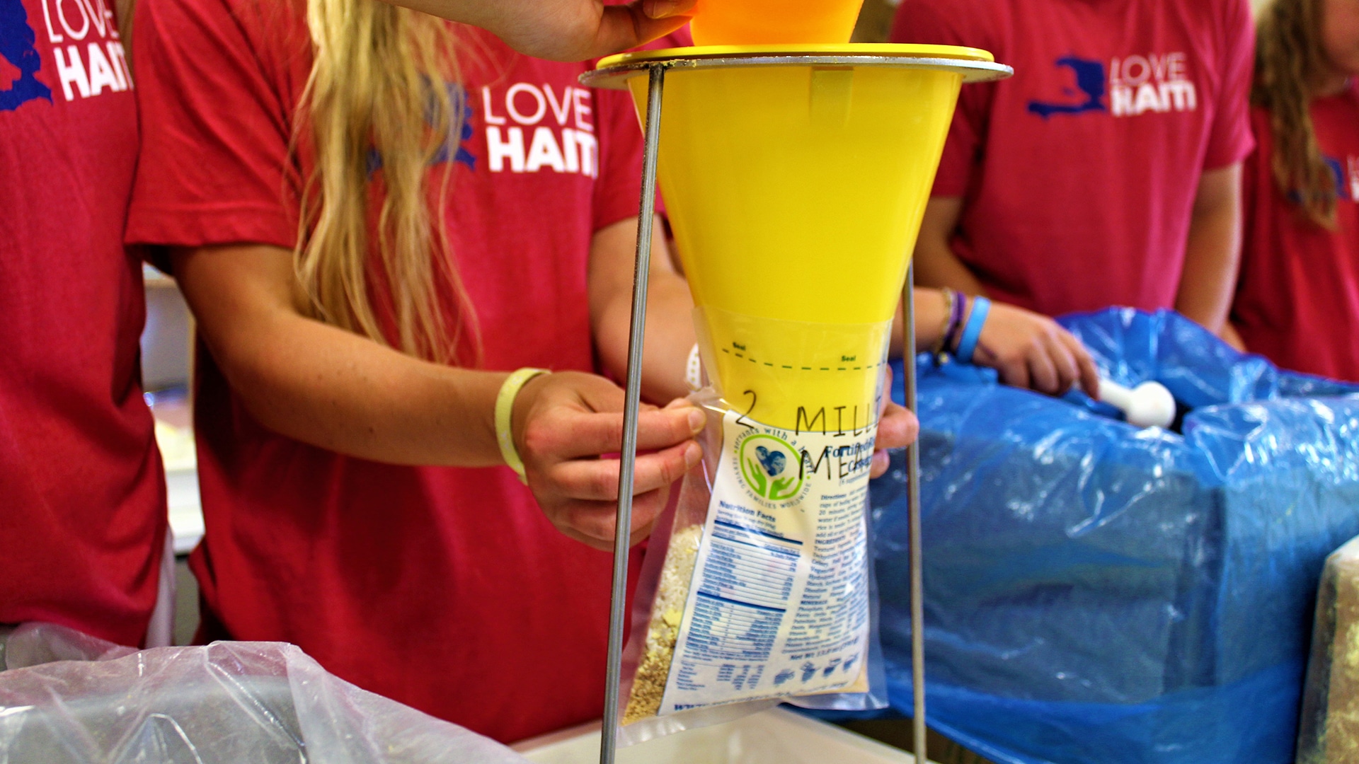 Campers pack 2 millionth meal for Haiti
