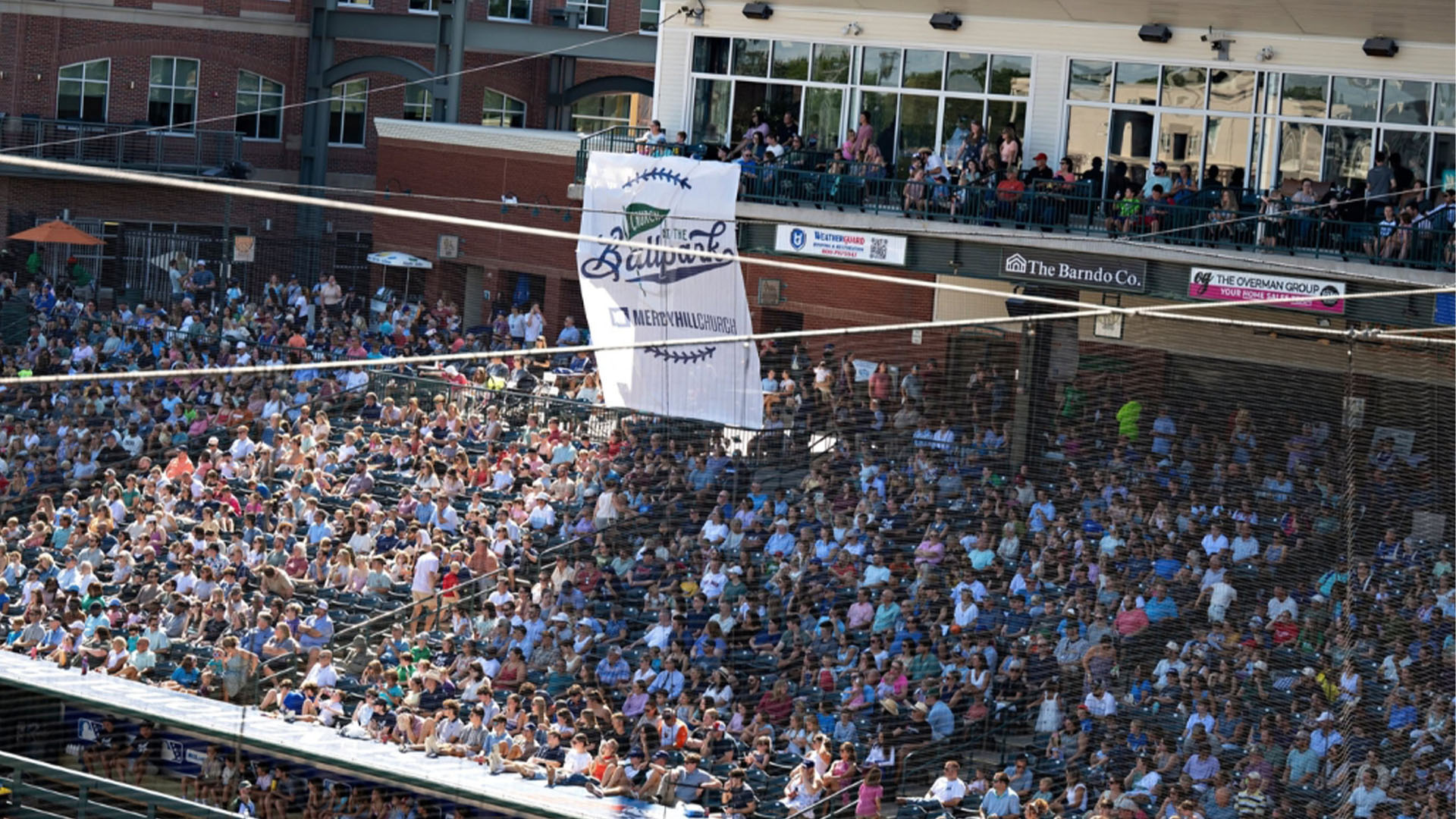 Image for Mercy Hill Church baptizes 141 in service at Greensboro ballpark